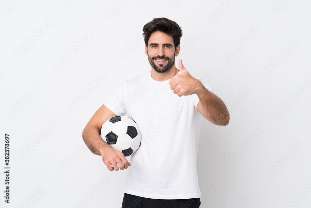 Young handsome man with beard over isolated white background with thumbs up because something good has happened