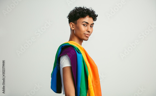 Man with a gay pride flag photo