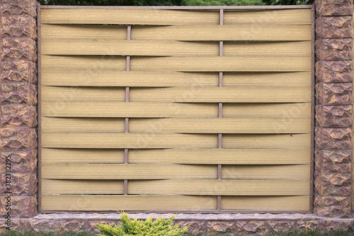 Bamboo straw mat. Abstract background texture of wicker bamboo fence.