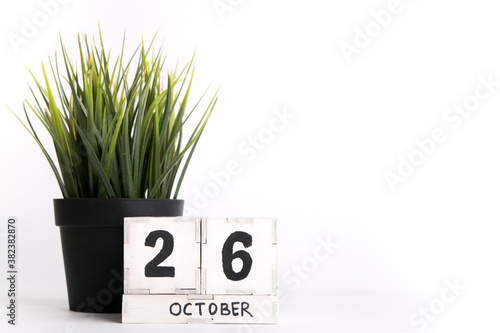 October 26, date on a wooden background