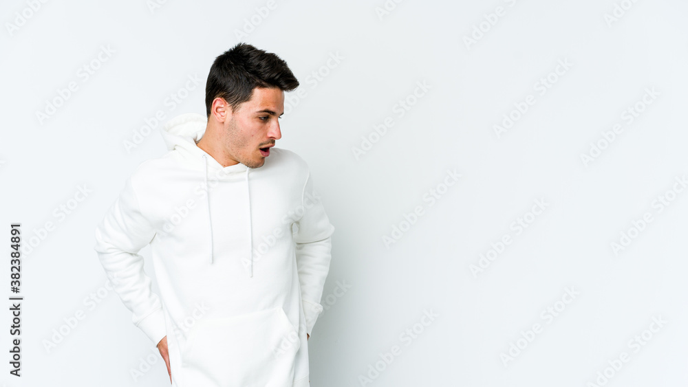 Young caucasian man isolated on white background being shocked because of something she has seen. Young caucasian man isolated on white background being shocked because of something she has seen.