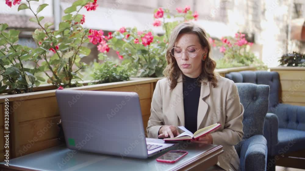 Young woman teacher conducts a lesson remotely using a laptop. New circumstances due to quarantine. Conversation via videoconference. Young woman teacher conducts a lesson remotely using a laptop. New circumstances due to quarantine. Conversation via videoconference.