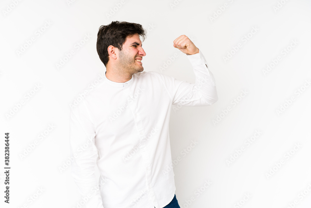 Young man isolated on white background celebrating a victory, passion and enthusiasm, happy expression. Young man isolated on white background celebrating a victory, passion and enthusiasm, happy expression.