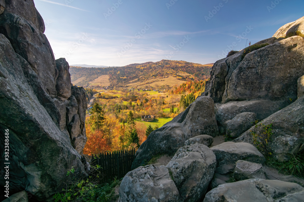 Breathtaking view from Tustan fortress to sunny valley in Carpathian Mountains, Ukraine at sunny autumn day