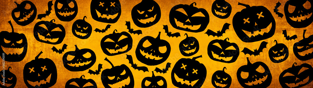HALLOWEEN symbol background template design -Top view Silhouette of scary carved luminous cartoon pumpkins isolated on dark orange yellow texture HALLOWEEN symbol background template design -Top view Silhouette of scary carved luminous cartoon pumpkins isolated on dark orange yellow texture