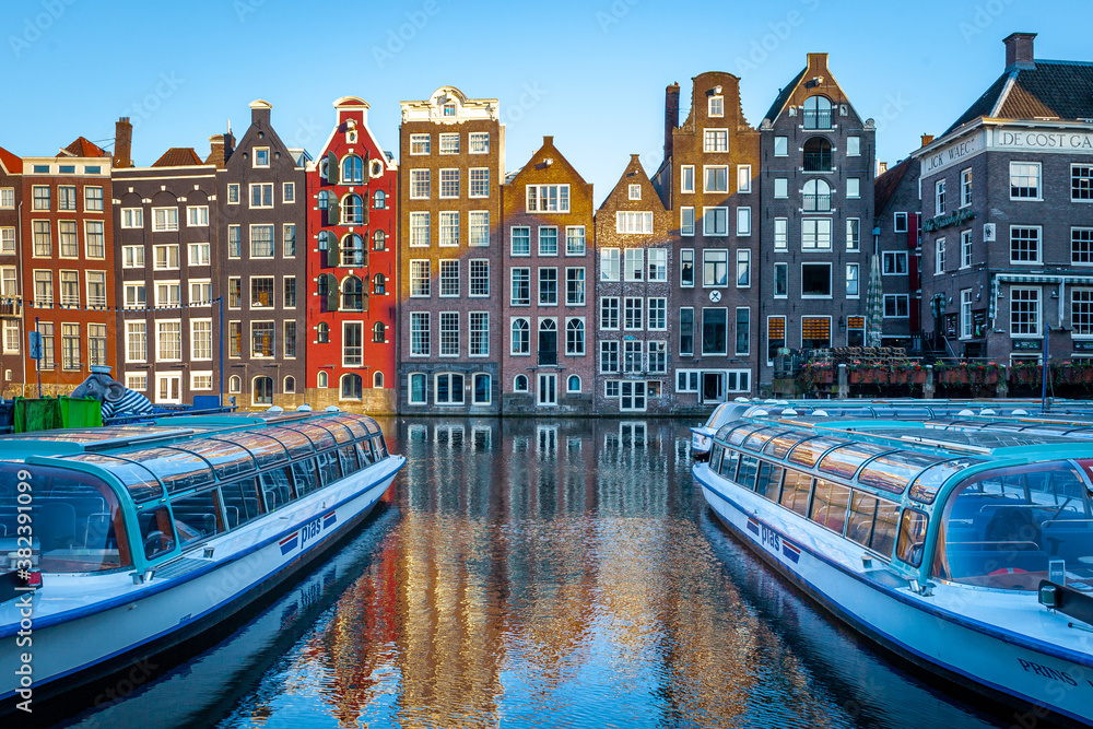 Amsterdam canal houses with canal boats, horizontal