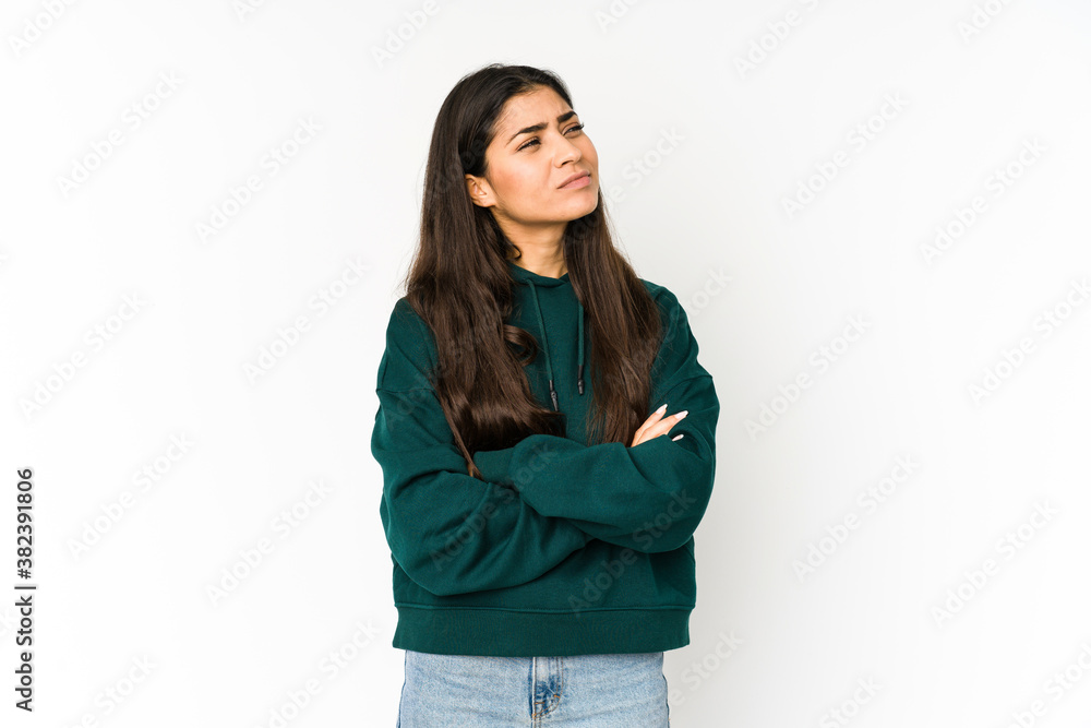Young indian woman isolated on purple background dreaming of achieving goals and purposes Young indian woman isolated on purple background dreaming of achieving goals and purposes