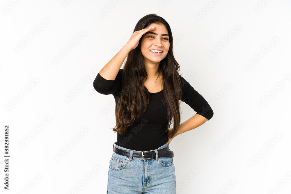 Young indian woman isolated on purple background joyful laughing a lot. Happiness concept.