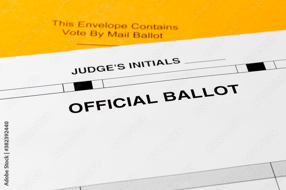 Vote by mail ballot and envelope. Concept of absentee and voting by mail for presidential election during Covid-19 coronavirus pandemic Vote by mail ballot and envelope. Concept of absentee and voting by mail for presidential election during Covid-19 coronavirus pandemic