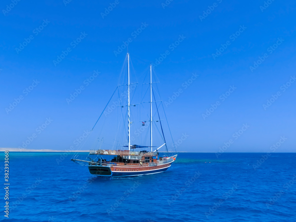 Sail boat ship with tourists in Ras Mohamed National Park in the Red Sea, Sharm El Sheikh Sail boat ship with tourists in Ras Mohamed National Park in the Red Sea, Sharm El Sheikh