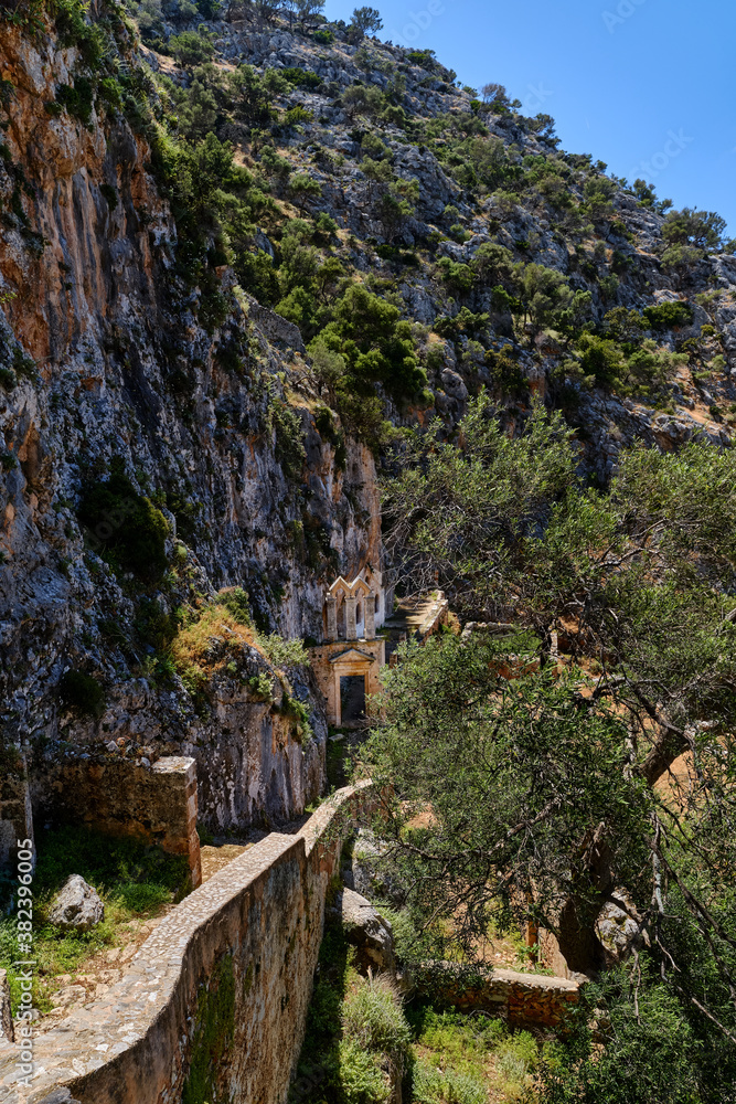 Ruins of abandoned Orthodox Katholiko monastery in Avlaki gorge, Akrotiri peninsula, Chania, Crete, Greece. Ruins of entrance gate to the area.