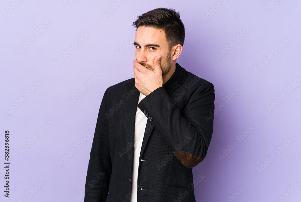 Young caucasian man isolated on purple background covering mouth with hands looking worried. Young caucasian man isolated on purple background covering mouth with hands looking worried.