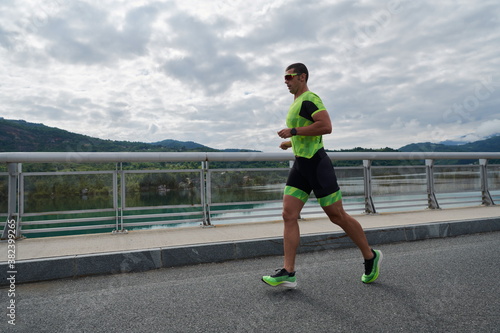 triathlon athlete running on street © .shock