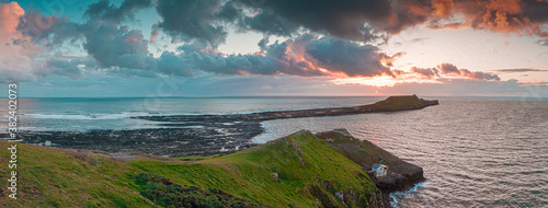 Sunset over Gower Peninsular Rhossilli Bay Worm Rock Formation