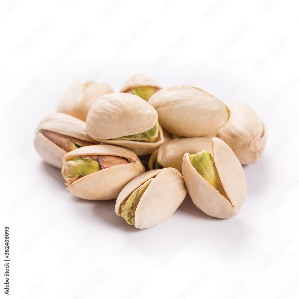 Composition of pistachios on the white background Composition of pistachios on the white background