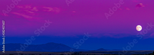 Obraz na plátně Landscape of an amazing colorful blue and pink and magenta moonscape moon rise d