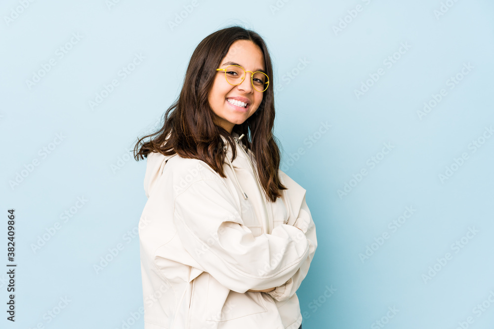 Young mixed race hispanic woman isolated who feels confident, crossing arms with determination. Young mixed race hispanic woman isolated who feels confident, crossing arms with determination.