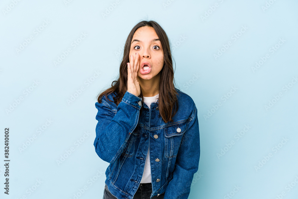 Young mixed race hispanic woman isolated is saying a secret hot braking news and looking aside Young mixed race hispanic woman isolated is saying a secret hot braking news and looking aside