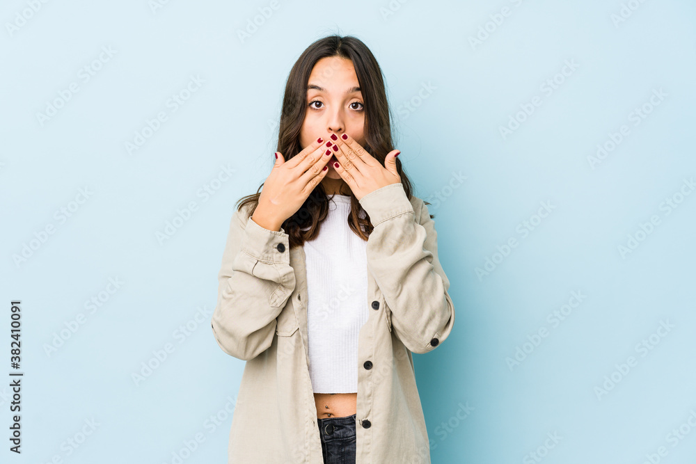 Young mixed race hispanic woman isolated shocked covering mouth with hands. Young mixed race hispanic woman isolated shocked covering mouth with hands.