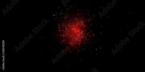 Red fireworks over black sky