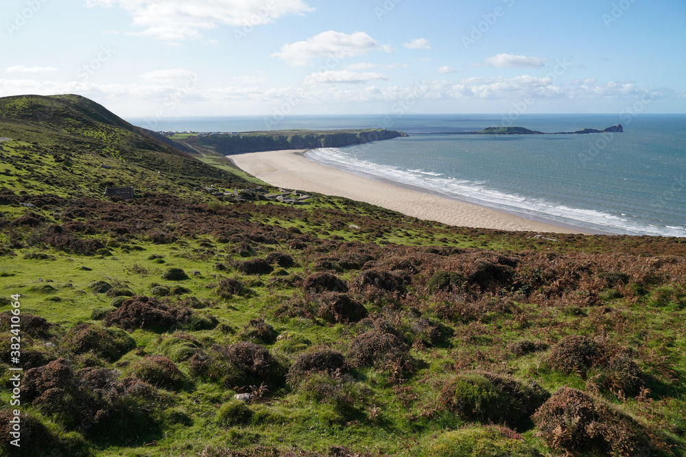 Gower Peninsular Rhossilli Bay Panoramic with Green Hills surrounding the Sandy Bay - Green Welsh Hillsides Gower Peninsular Rhossilli Bay Panoramic with Green Hills surrounding the Sandy Bay - Green Welsh Hillsides