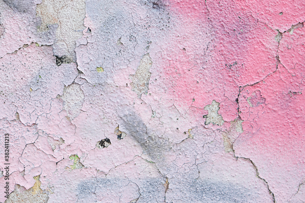 Obraz premium Pink spray paint on cracked rough concrete wall.