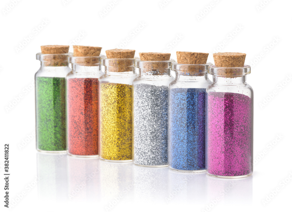 Row of colorful glitter bottles Row of colorful glitter bottles