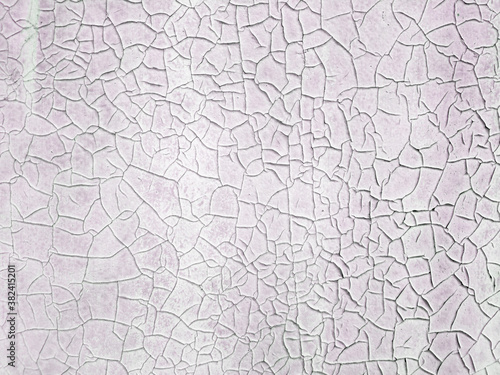 Texture of a painted pink wall with cracks. Concept background, texture.