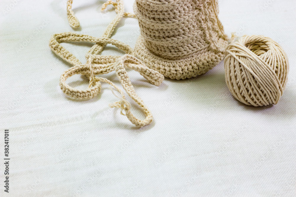 Obraz premium Background copy space handmade crochet handicraft from white cotton yarn.