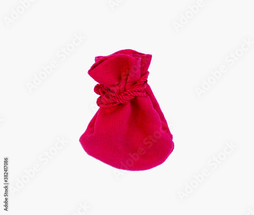 Small red velvet pouch on white background
