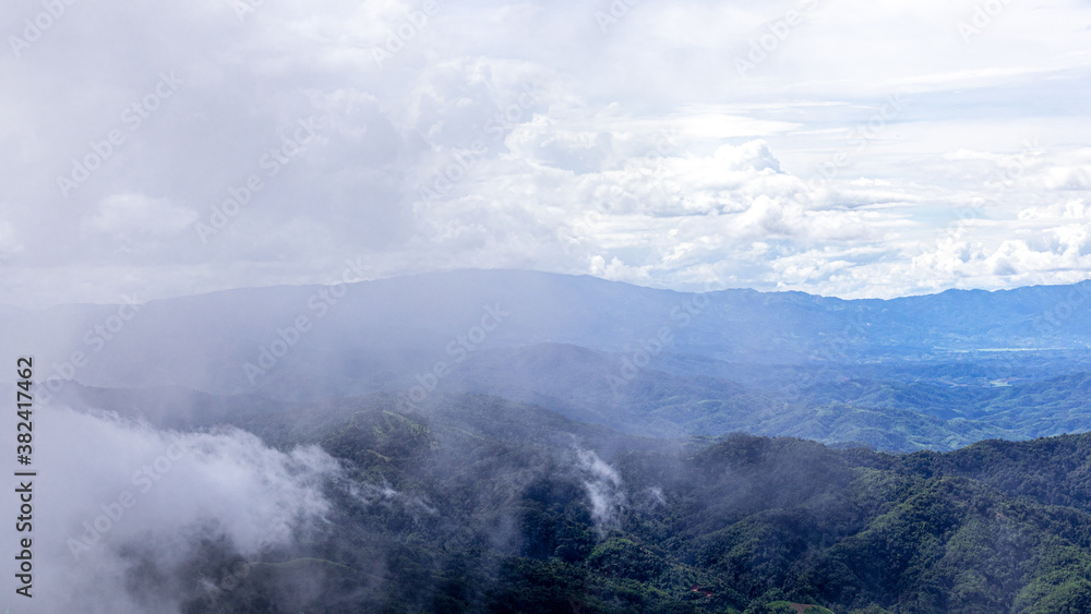 Fog is passing through the mountains of northern Thailand in the rainy season. Fog is passing through the mountains of northern Thailand in the rainy season.