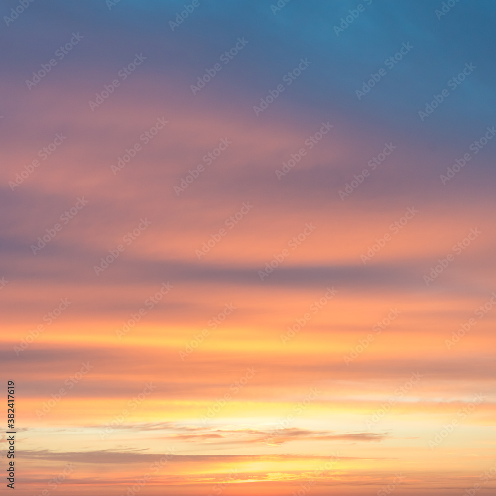 Orange and blue clouds at sunrise