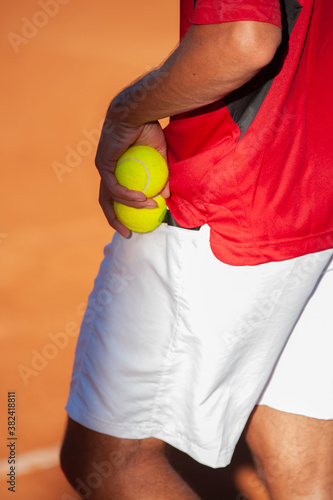 tennis player training on a court © Oquio