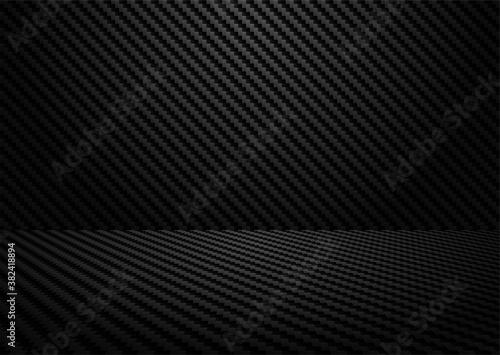 Abstract. Black carbon fiber background. light and shadow. Vector.