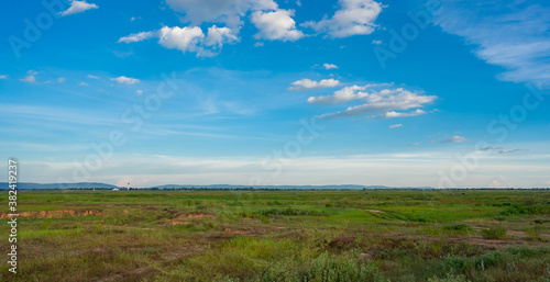 Blue sky and white cloud over land background