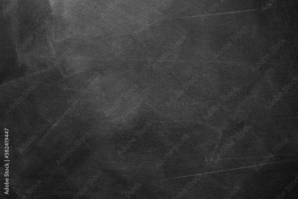 Naklejka premium Texture of chalk rubbed out on blackboard or chalkboard background. School education, dark wall backdrop or learning concept.