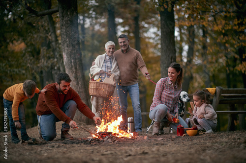 Family camping in the woods; Quality family time concept
