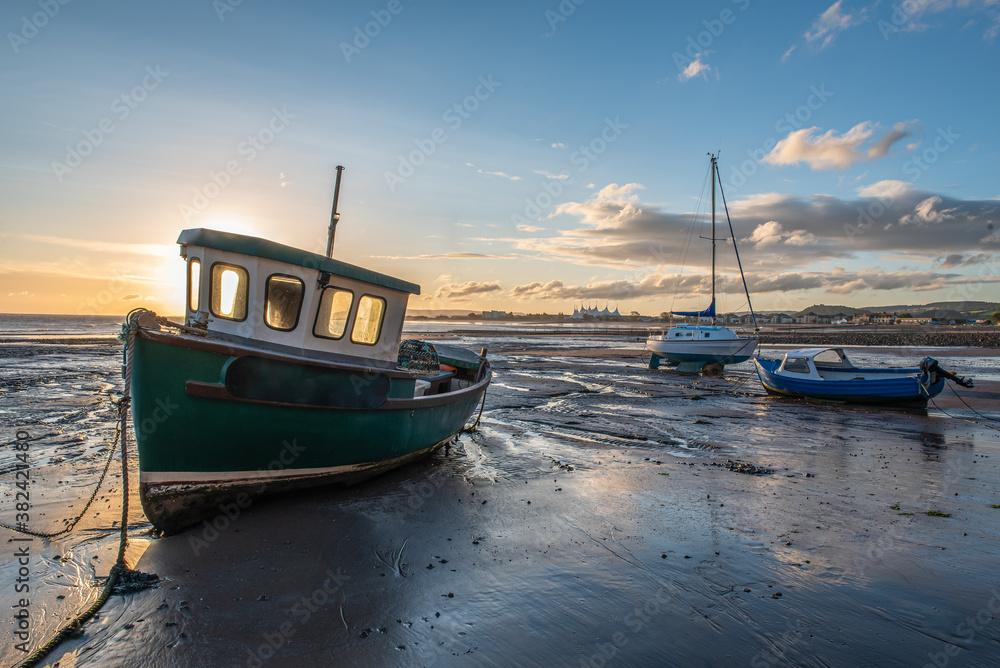 Boats at low tide sunrise