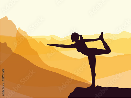 Silhouette of girl practising yoga. Mountains in the background. Sunrise, yoga sun salutation. Healthy lifestyle.