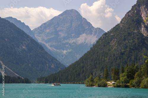  sunny day on the turquoise Lake Plansee in the Austrian Alps