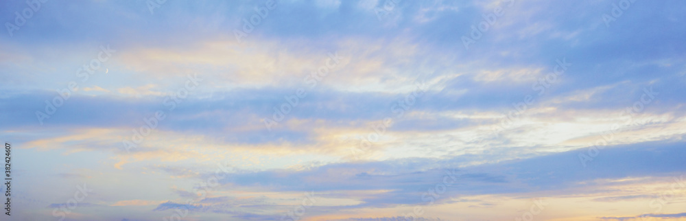 Blue sky and clouds at sunset, background