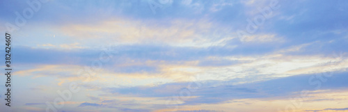 Blue sky and clouds at sunset, background