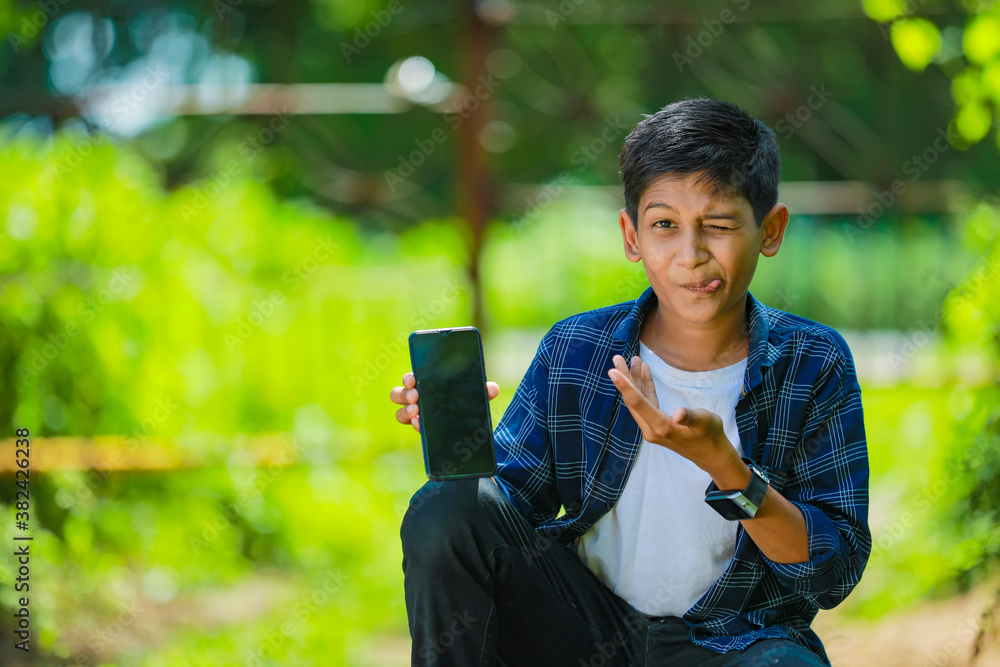 childhood, technology and people concept - indian cute school boy ...