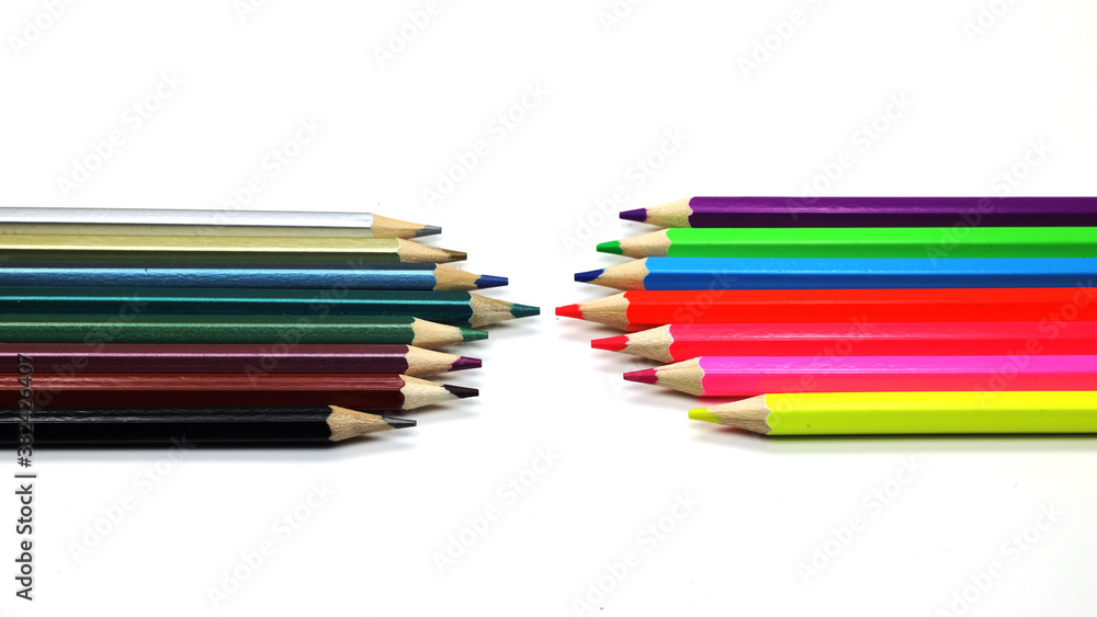 colored pencils lie opposite each other on a white background, isolated, close-up, macro colored pencils lie opposite each other on a white background, isolated, close-up, macro
