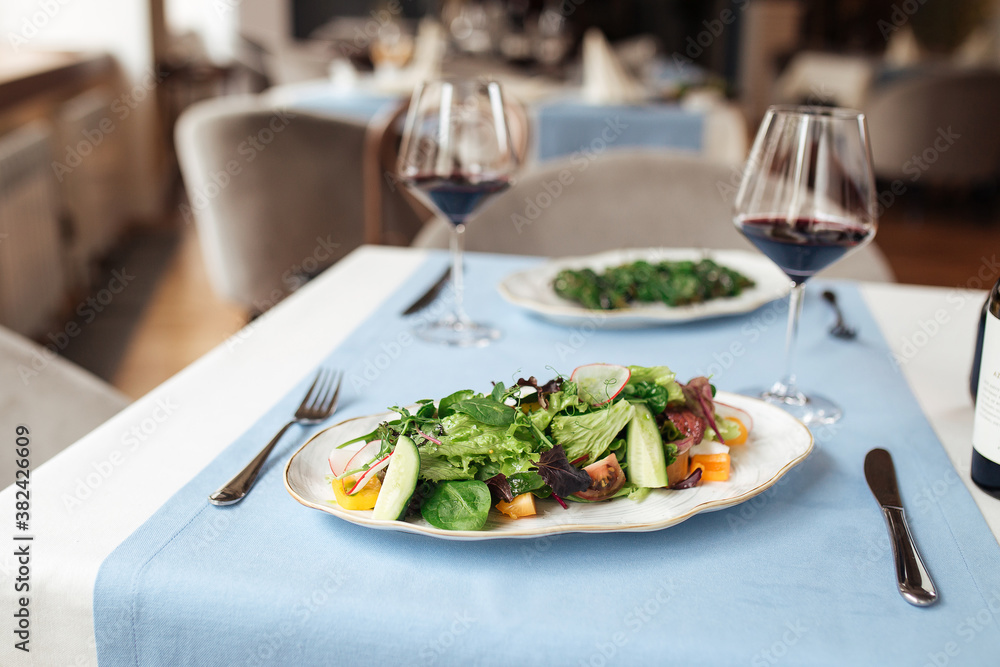 Fresh vegetables salad on served restaurant table Fresh vegetables salad on served restaurant table
