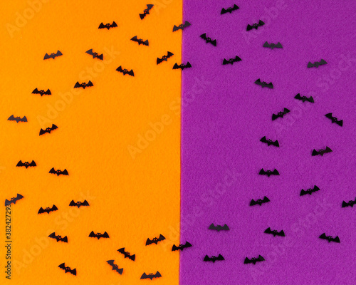 Kids Halloween vampire Bats in black on orange and purple backdrop © Martin and Dawn Q