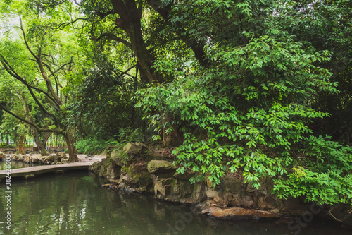 Rocks trees by water in Lanting (Orchid Pavilion) scenic area in Shaoxing, China