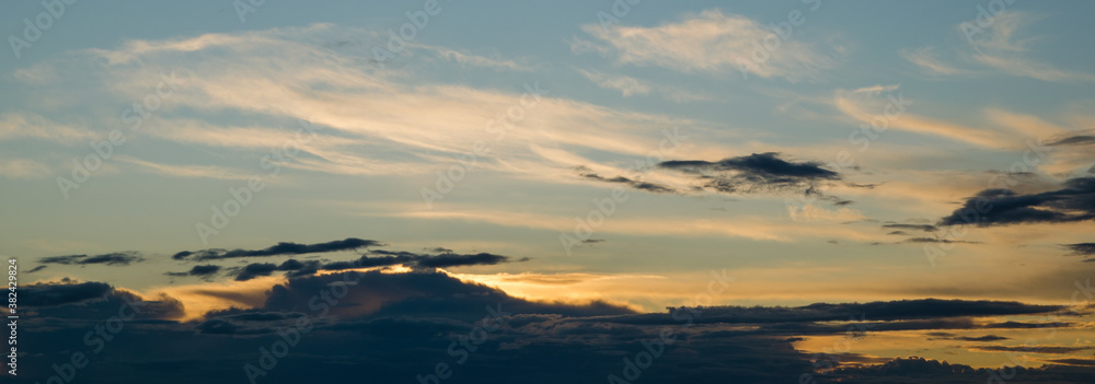 Sunset in the blue sky with white clouds