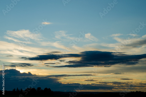 Sunset in the blue sky with white clouds