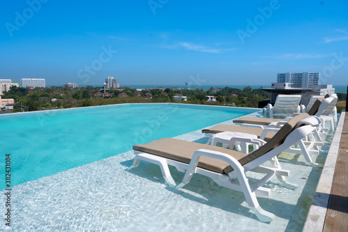 chair on luxury swimming pool © arnonphoto